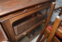 An early 20th Century light mahogany stacking style two tier bookcase, width approx. 94cm, height