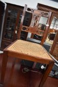 An early 20th Century cane seated chair