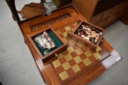 A modern hardwood occasional games table having brass inlay decoration, and reversible lid with