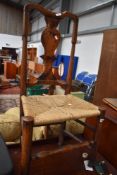 A period oak and elm vase back chair having later strung seagrass style seat