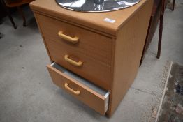 A modern laminate chest of three bedroom or similar drawers