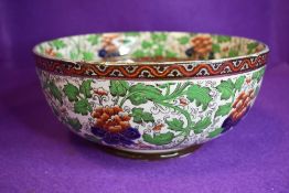 A Royal Doulton fruit bowl having floral transfer pattern with hand tinted details in green,