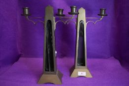 A pair of antique brass candle stick holder with glass inserts to front(currently loose and will