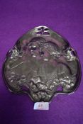 A heavy bon bon dish or similar depicting two ladies and floral sprigs in the art nouveau style.