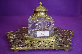 A substantial Townsend & co glass inkwell with intricately detailed tray and lid.