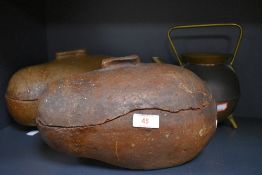An unusual pair of stoneware hedgehog roasters and a brass and copper kettle.