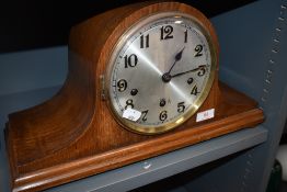 A vintage oak cased Haller Humpback clock.
