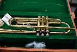A Chinese brass trumpet, stamped Singha , in velvet lined case
