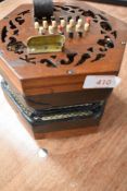 A traditional 48 button concertina, probably Lachenal late 19th/early 20th Century, some splitting