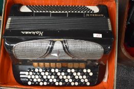 A vintage Hohner Riviera IV button accordion, in vintage lined card case