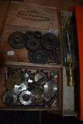 A selection of machine workshop boring bits and similar gear cogs and wheels