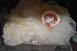 Two retro wedding dresses and and accessories.