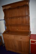 A vintage teak dresser of traditional form , shipped in by the owner from the Far East in the 1970s,