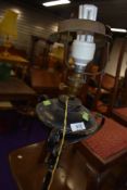 A wrought metal standard lamp, originally probably gas or oil and converted to electric, old