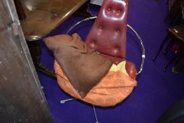A vintage vinyl swivel armchair having button back and seat and chrome frame, seat damaged and