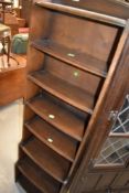 An early 20th Century stained frame narrow waterfall style bookcase, height approx. 165cm