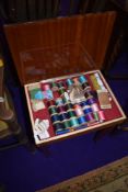 A Continental style sewing table of small proportions, fitted interior containing a number of