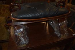 A traditional hardwood camel stool having brass inlay decoration