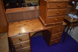 A modern pine dressing table and similar three drawer bedside chest