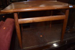 A vintage Danish teak coffee table of stylised form , labelled Glostrup Mobelfabrik, having turned
