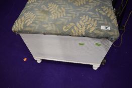A traditional woven fibre box stool