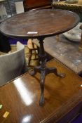 A traditional mahogany occasional or wine table having circular top, diameter approx. 38cm, triple