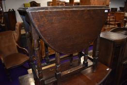 A traditional oak gate leg dining table