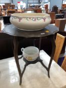 An early 20th Century stained frame occasional table having shaped top