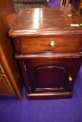 A reproduction hardwood pot cupboard in the Victorian style
