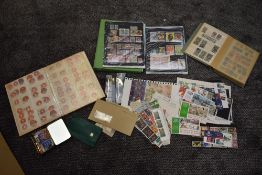 A collection of World Fiscals and Cinderella's etc in albums, on hangers and in packets