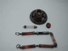 A Scottish hardstone part bracelet having five (plus 1) agate octagonal batons with white metal