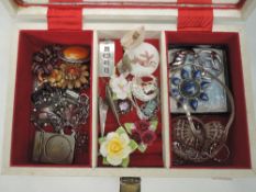 A jewellery box containing a selection of silver and costume jewellery including Monet, lapis