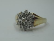 A lady's dress ring having a diamond chip triple cluster in a stepped mount to shaped shoulders on a