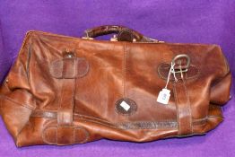 A vintage leather duffel or sports bag bearing label Topeu