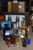 A large novelty hip flask, Binoculars, and a collection of gents fragrances.