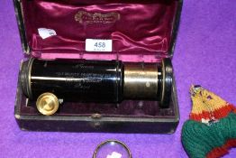 An antique cased brass bodied lens Extension No. 103525 Tele Objectif Panorthoscopeique in great
