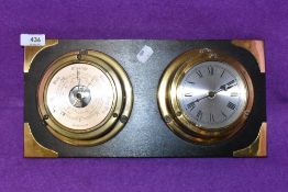 A ships style porthole clock and barometer set