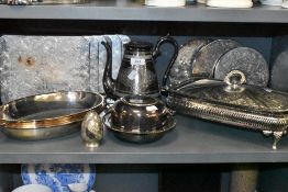 A selection of plated wares including serving mats and lidded glass lined serving dish