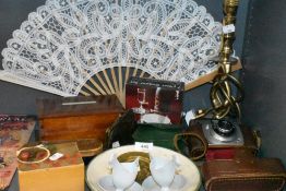 A selection of curios and decorations including brass twist stem lamp base Ilford camera and trinket