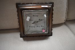 A mid 20th Century barometer in square oak case