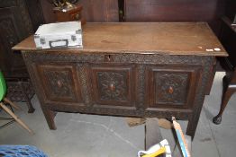 A late 19th century converted oak Kist base having similar dresser back with carved panel doors