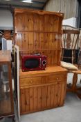 A pine sideboard and back or dresser having double draw and under cupboard