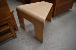 A vintage bent ply occasional table or stool of triangular form in the style of Bloom, max width