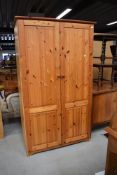 A modern laminate and pine wardrobe