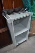 A painted bathroom side cabinet