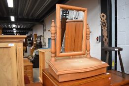 A natural pine toilet mirror having storage base