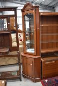 A reproduction corner display, Rossmore or similar, orginal price £650