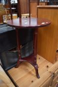 A reproduction rosewood occasional table