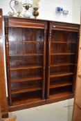 A pair of oriental hardwood open bookshelves, having concealed upper drawer