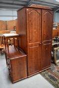 A modern pine wardrobe and dressing table with stool, reddish stain